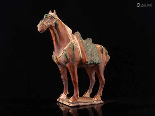 A THREE-COLOR FORM TANG DYNASTY HORSE SHAPED ORNAMANET