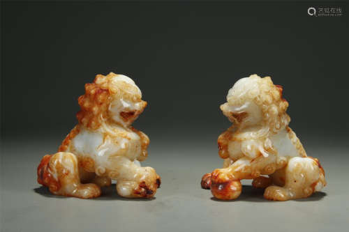 A PAIR OF JADE LION SHAPED FIGURE