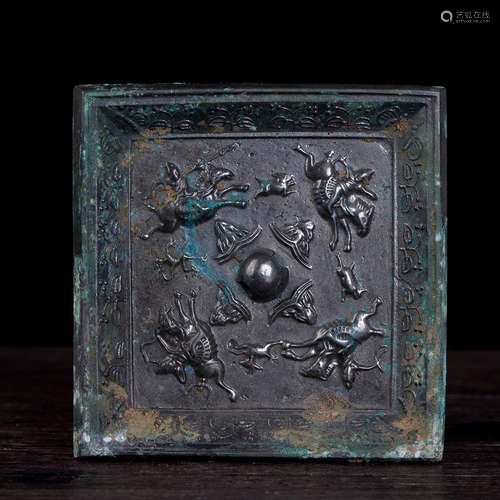 A BRONZE SQUARE MIRROR