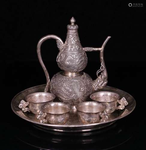 A SET OF CHINESE SILVER TEAPOT & CUPS(4 PIECES) W/ A PLATE,