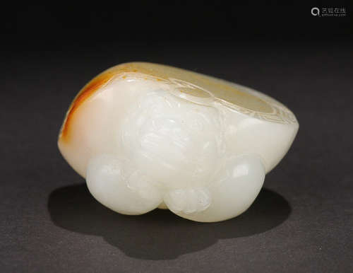 A HETIAN JADE BEAST ORNAMENT