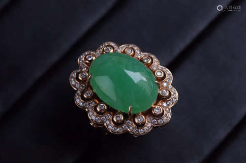 A JADEITE EGG SHAPED RING SURROUNDED WITH DIAMONDS