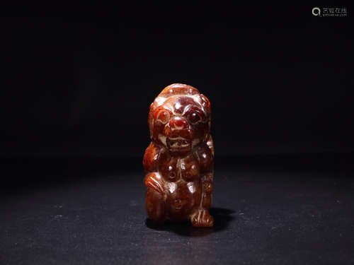 A YELLOW HETIAN JADE ORNAMANET OF BEAST SHAPED