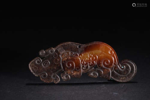 A HETIAN JADE CARVED BEAST PENDANT