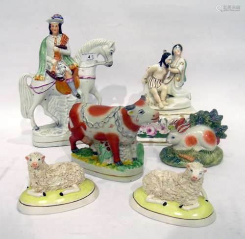 Staffordshire pottery equestrian figure of a Highland bagpiper, a porcelain group of Pero and