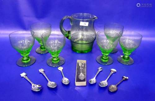 Set of six green glass wines with tapering bowls, matching water jug and small quantity of