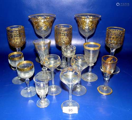 Gilt and clear liqueur ewer, scrolling foliate decorated, three matching stemmed liqueur glasses,
