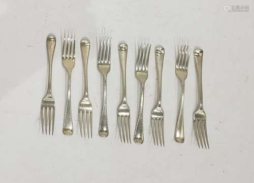 Nine assorted London silver forks, various makers and dates, feather edged, 10 troy oz approx