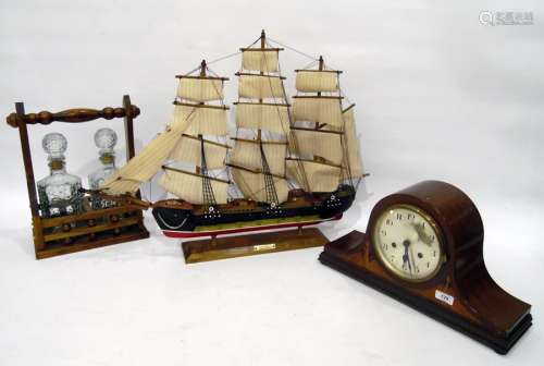 Mahogany mantel clock in Napoleon's hat shaped case, with chiming movement, two bottle tantalus