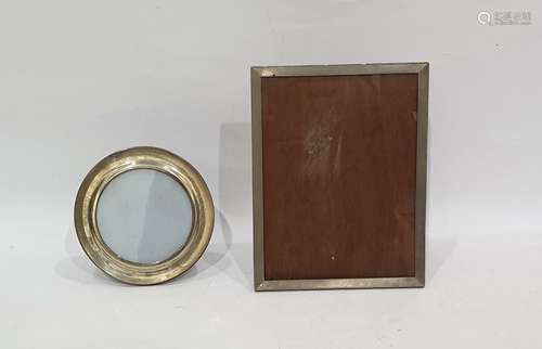 Circular silver photograph frame and another silver photograph frame (2)