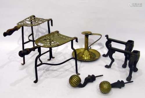 Two brass trivets, antique brass chamberstick and two andirons (5)