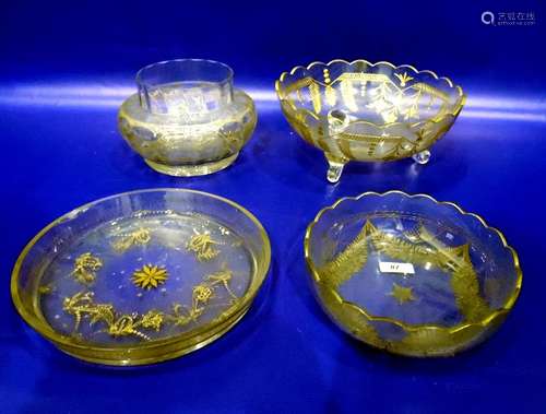 Gilt glass fruit bowl with scalloped edge, floral fern decorated, on three scroll feet, 26cm