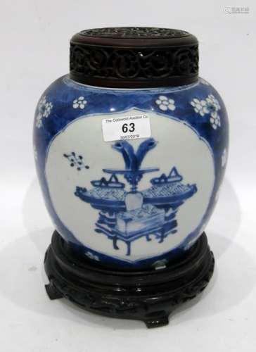 Oriental blue and white porcelain ginger jar decorated with panels of vases on blue and white prunus