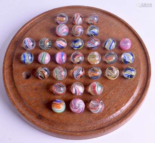 A VICTORIAN SOLITAIRE SET OF MARBLES. (qty)