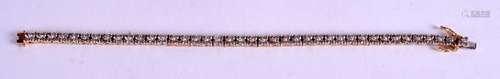 AN 18CT GOLD AND DIAMOND SECTION BRACELET, the diamonds