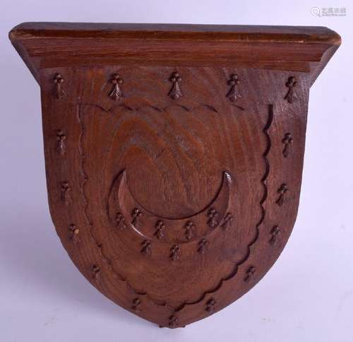 A GOOD ARTS AND CRAFTS CARVED WOOD WALL BRACKET Trinity