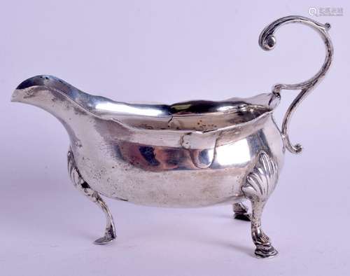 A SOLID SILVER SAUCEBOAT BEARING LONDON HALLMARKS,