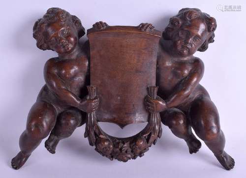 A 19TH CENTURY CONTINENTAL FRUIT WOOD DOUBLE CHERUB