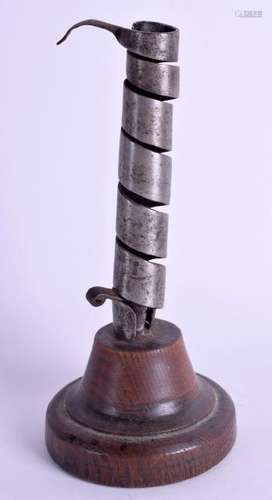 AN 18TH CENTURY CONTINENTAL PIG TAIL CANDLESTICK. 22 cm