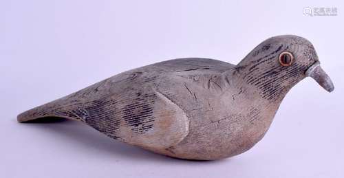 AN ANTIQUE PINE PIGEON DECOY. 31 cm long.