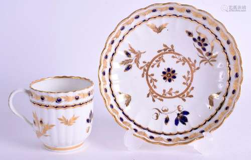 AN 18TH CENTURY WORCESTER FLUTED COFFEE CUP AND SAUCER