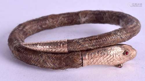 A RARE 19TH CENTURY GOLD MOUNTED SNAKE BANGLE, inset