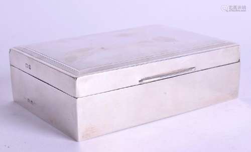 A SOLID SILVER CIGARETTE BOX BEARING BIRMINGHAM