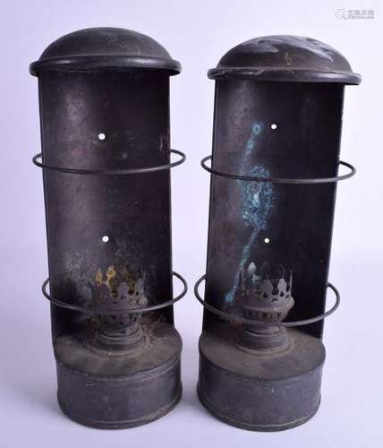 A similar pair of weathered copper circular oil lamps,