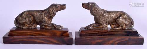 A PAIR OF ANTIQUE BRONZE FIGURES OF HOUNDS. 15 cm wide.