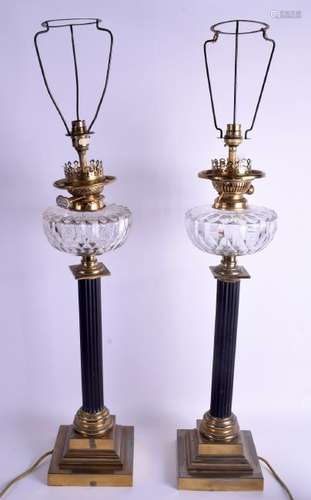 A PAIR OF ANTIQUE BRASS AND CRYSTAL OIL LAMPS. 60 cm