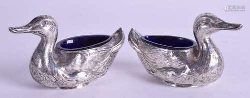 A PAIR OF SOLID SILVER SALTS IN THE FORM OF DUCKS,