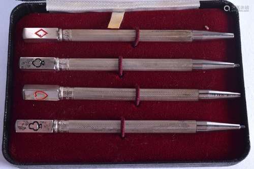 A CASED SET OF FOUR SOLID SILVER PROPELLING PENCILS OF