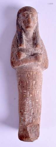 AN EGYPTIAN CARVED USHABTI FIGURE. 18 cm high.