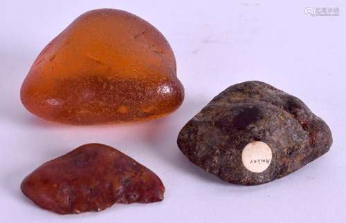 THREE ANTIQUE AMBER BLOCKS. 60 grams. (3)