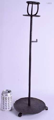 A LARGE IRON PRICKET CANDLESTICK. 61 cm high.