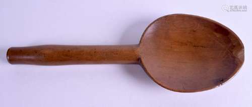 AN ANTIQUE TREEN SPOON. 28 cm long.