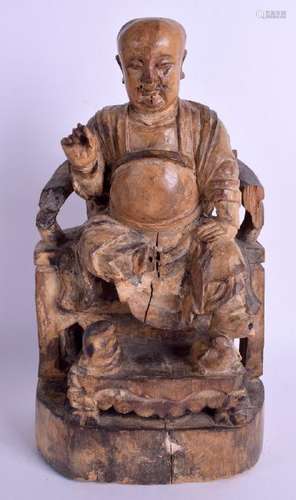 AN 18TH CENTURY CHINESE CARVED WOOD FIGURE OF A MALE