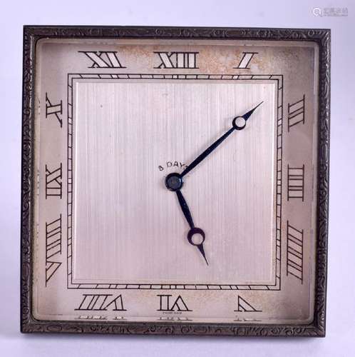 AN ART DECO BRASS EIGHT DAY DESK CLOCK. 10 cm square.