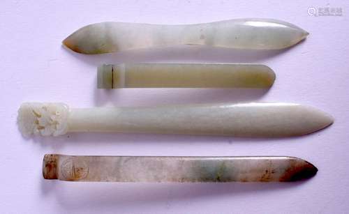 FOUR EARLY 20TH CENTURY CHINESE JADE HAIR SLIDES.