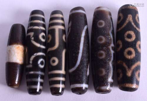 SIX CHINESE AGATE ZHU BEADS. Largest 5.5 cm long. (6)