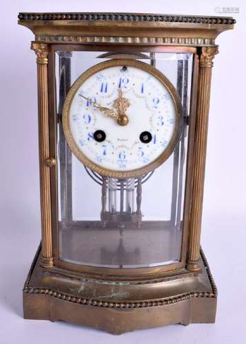 AN ANTIQUE FOUR GLASS BRASS REGULATOR MANTEL CLOCK. 26