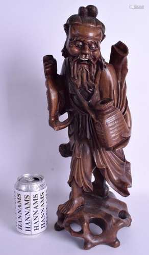 A LARGE 19TH CENTURY CHINESE CARVED ROOTWOOD IMMORTAL.