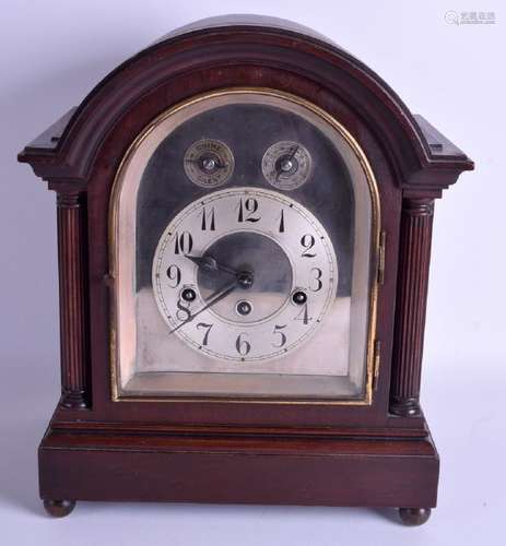 AN ANTIQUE MAHOGANY MANTEL CLOCK with Junghans