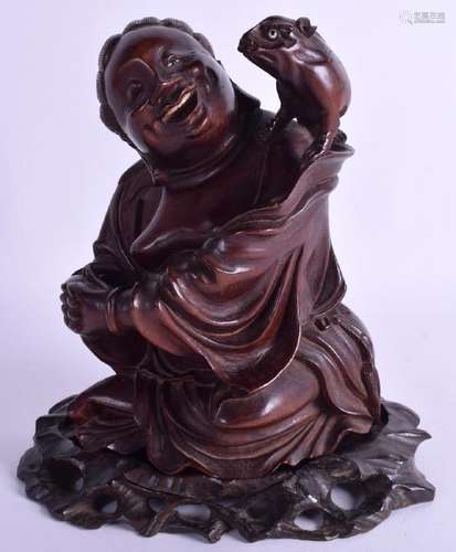 A 19TH CENTURY CHINESE CARVED HARDWOOD FIGURE OF A MALE