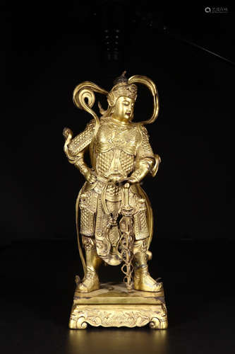 A GILT BRONZE BUDDHA ORNAMENT