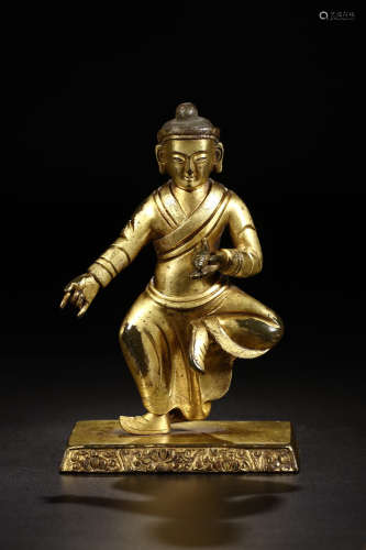 A GILT BRONZE STATUE