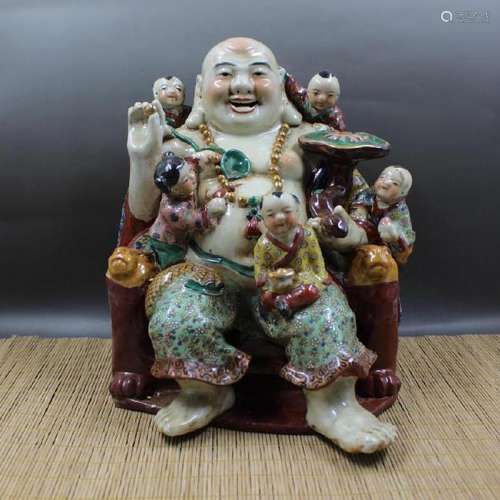 A PORCELAIN ENAMEL BUDDHA FIGURE QING DYNASTY.