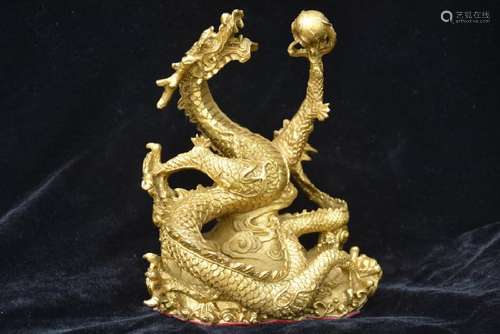 A GILT BRONZE DRAGON PLAY STATUE QING DYNASTY.