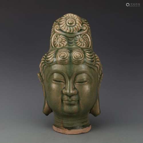 A CELADON PORCELAIN BUDDHA HEAD STATUE MING DYNASTY.