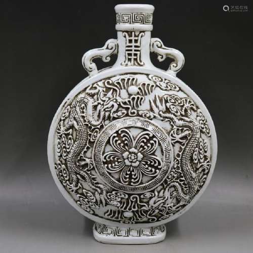 A WHITE DRAGON MOON FLASK MING DYNASTY.